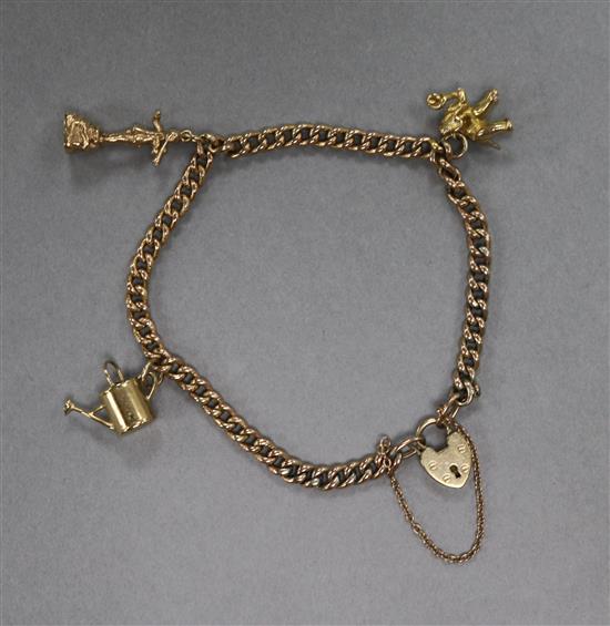 A 9ct gold charm bracelet, hung with three assorted 9ct gold charms.